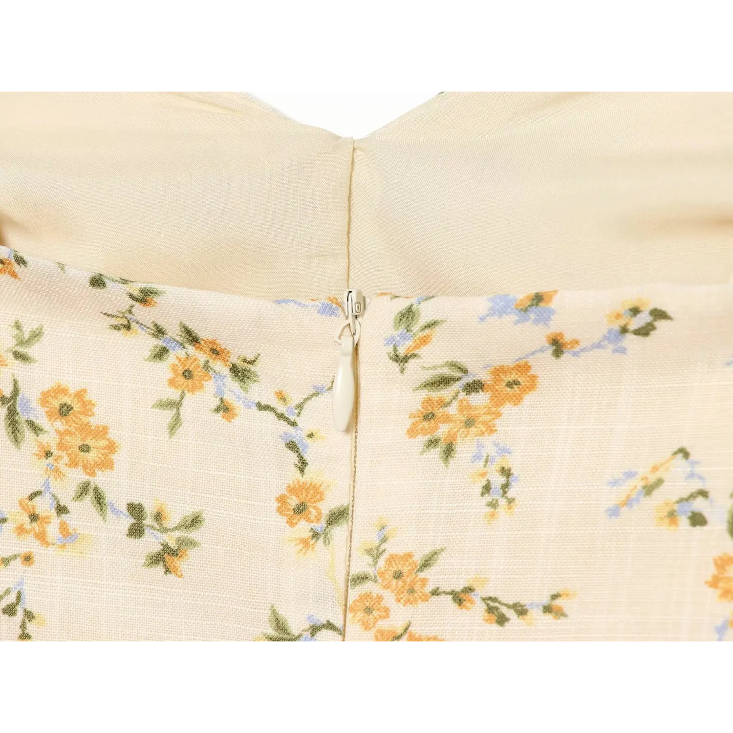 Textured woven yellow & blue tiny floral fabric macro flat close-up, subtle grid breathable texture soft watercolor floral print spring summer cloth shot