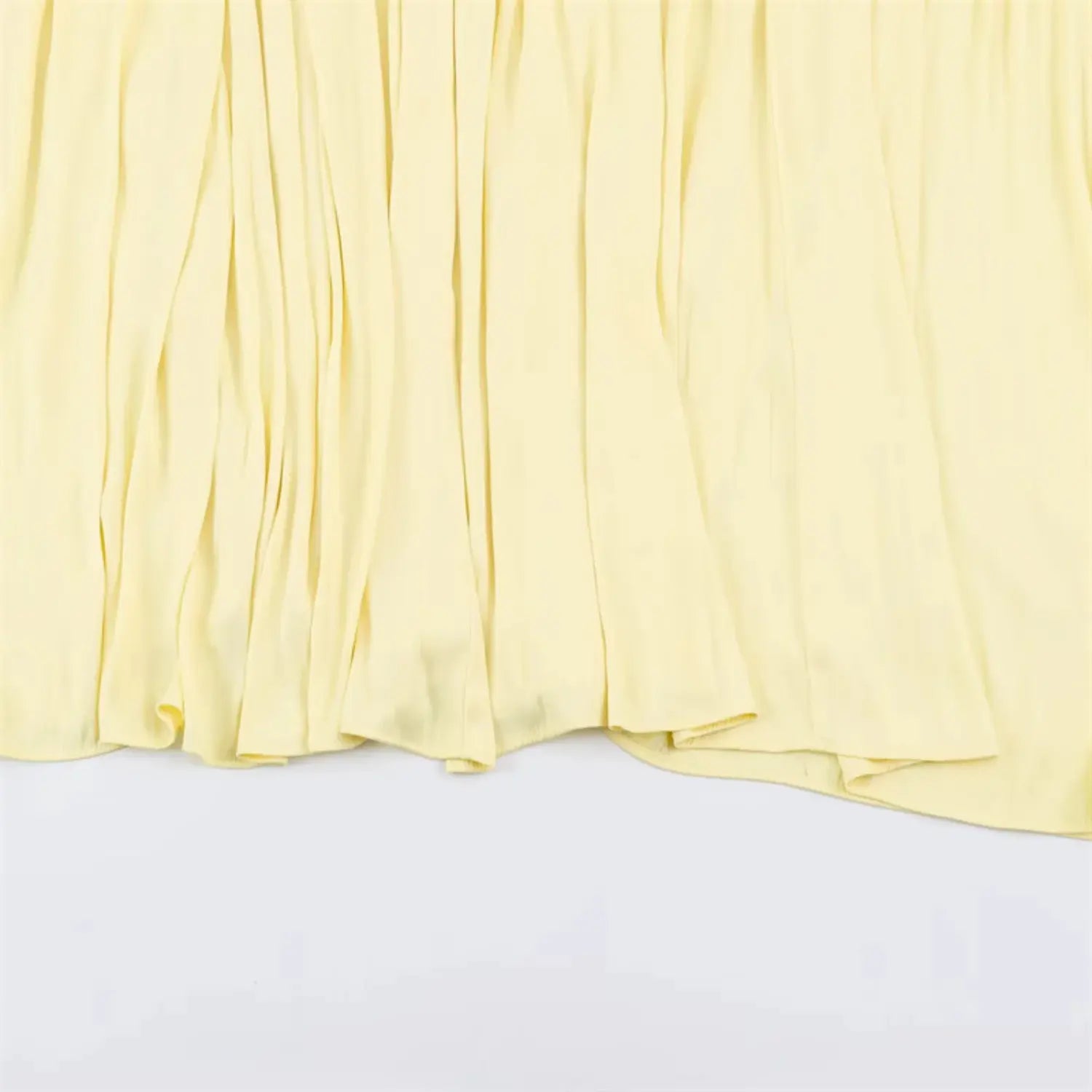 Fabric drape macro shot, soft lightweight woven material, natural vertical wrinkle pleated texture