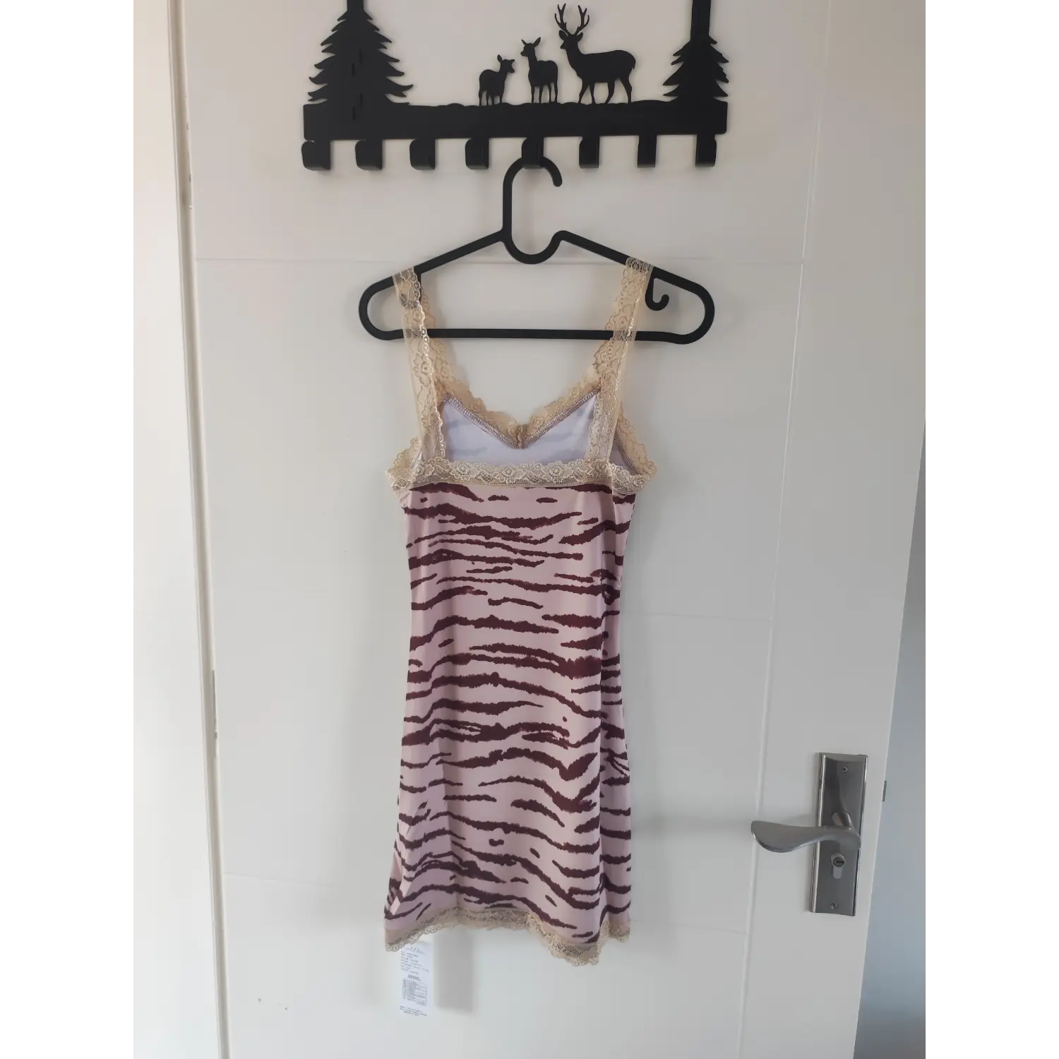 Hanging back shot, pink zebra cami dress with beige lace straps and hem trim