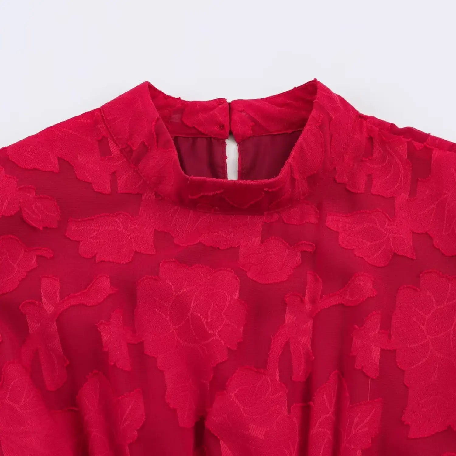 Crop top front neck macro shot, small stand cheongsam collar, vertical hollow keyhole cutout, single matching fabric frog button