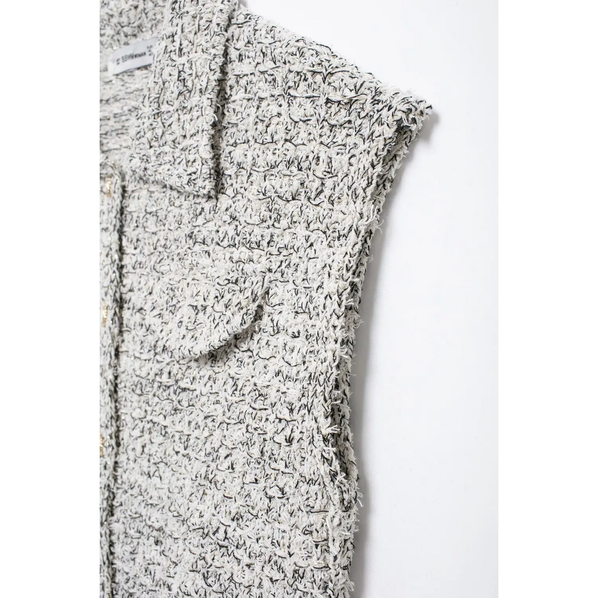 Close-up of armhole and shoulder seam
