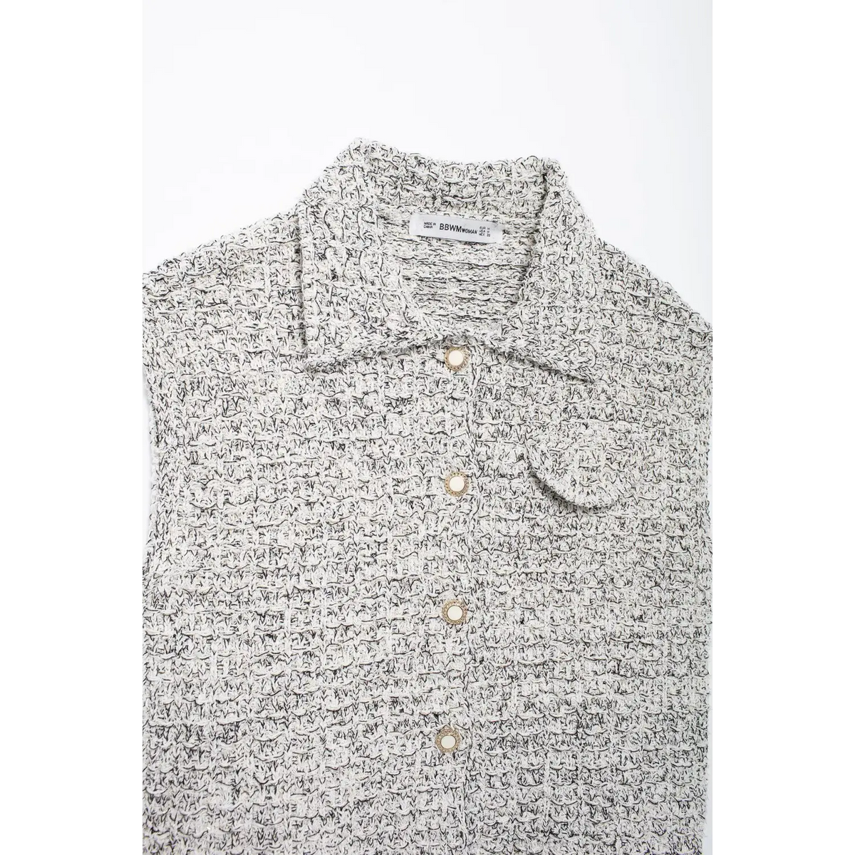 Close-up of collar placket buttons and chest pocket