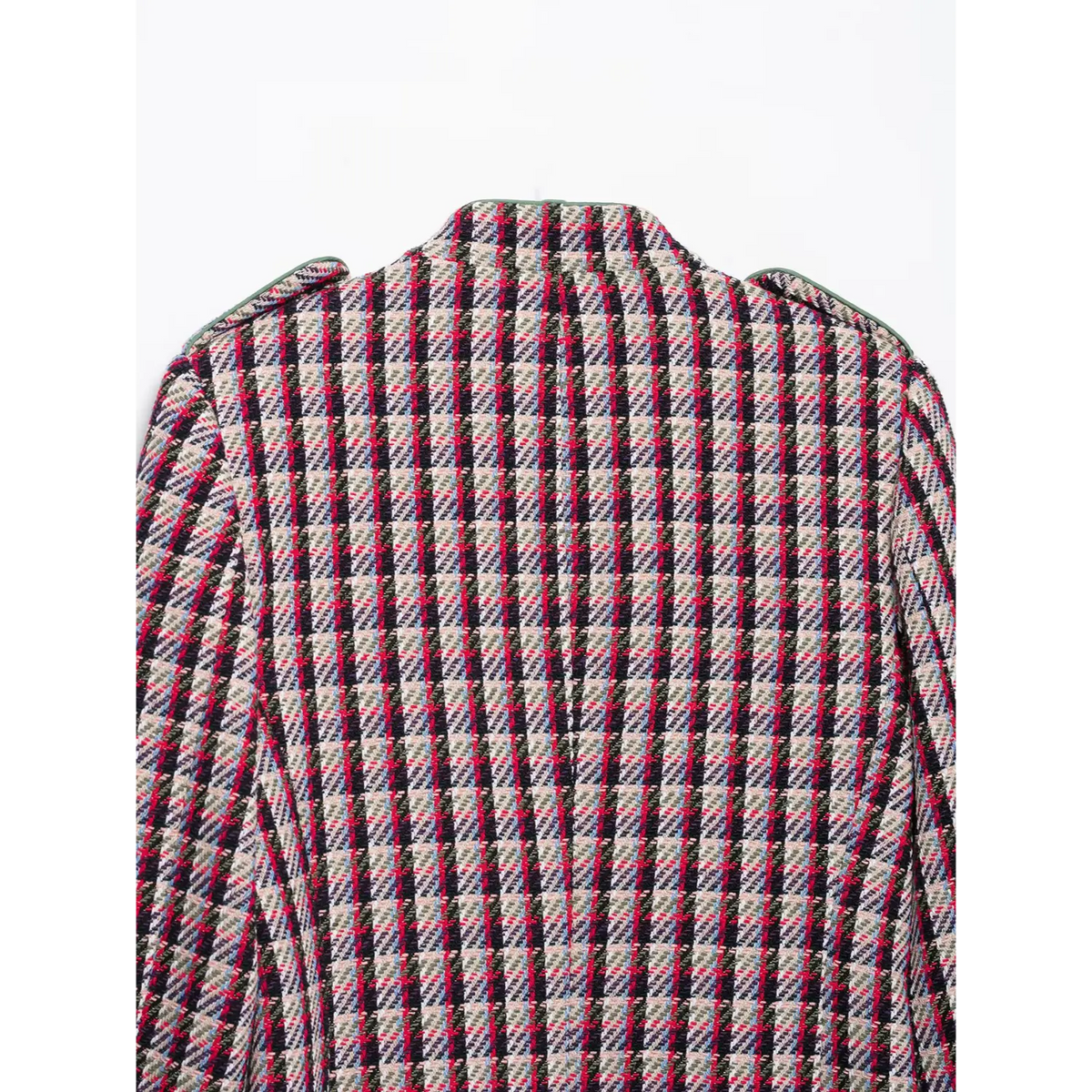 Close-up of plaid tweed fabric on back of jacket with green shoulder piping