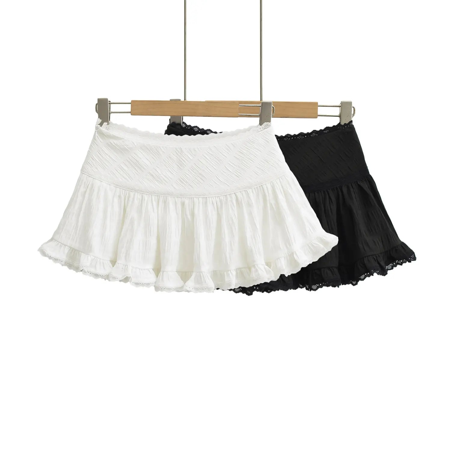 Black & white textured cake mini skirt wooden hanger combo shot, high waist scallop lace waistband layered gathered cake hem double eyelet lace hem with safety lining two color hero image