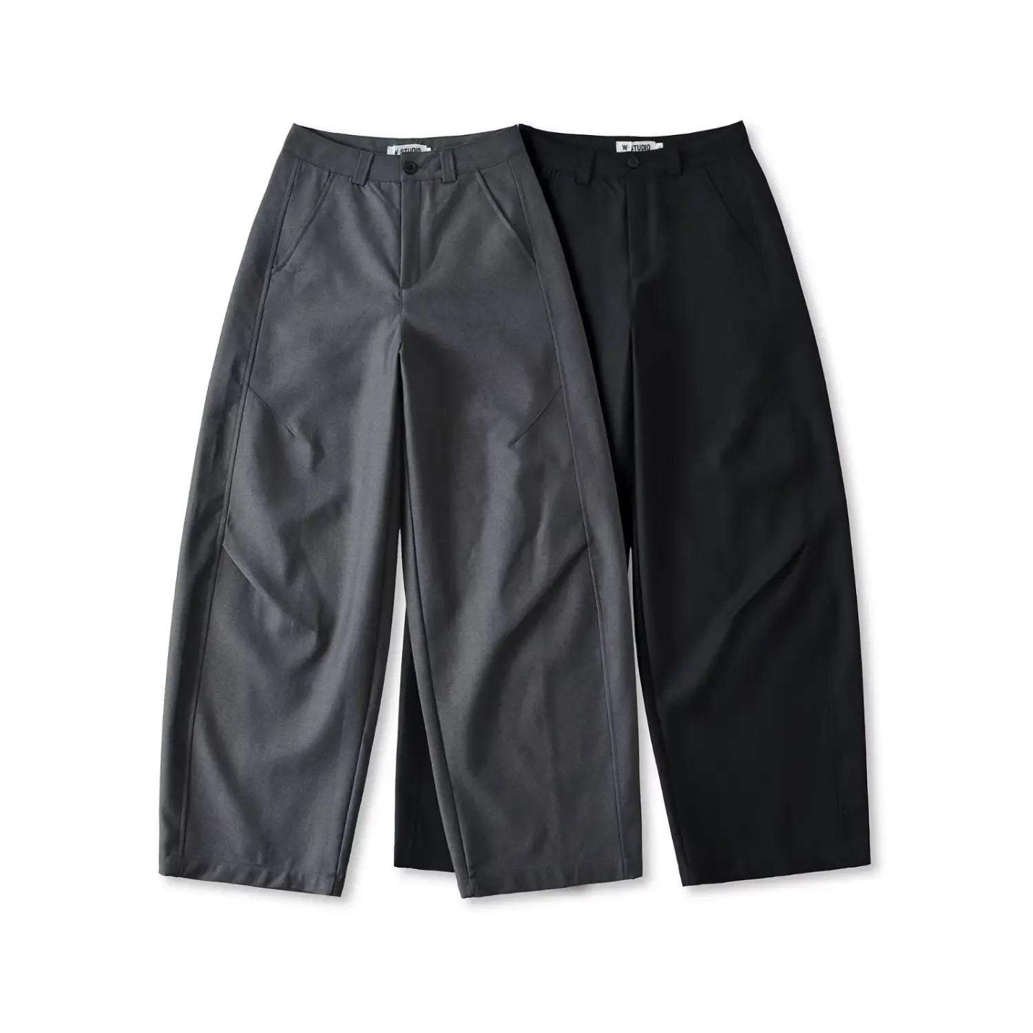 Flat lay top view of charcoal gray and black relaxed fit wide leg suit pants on white background