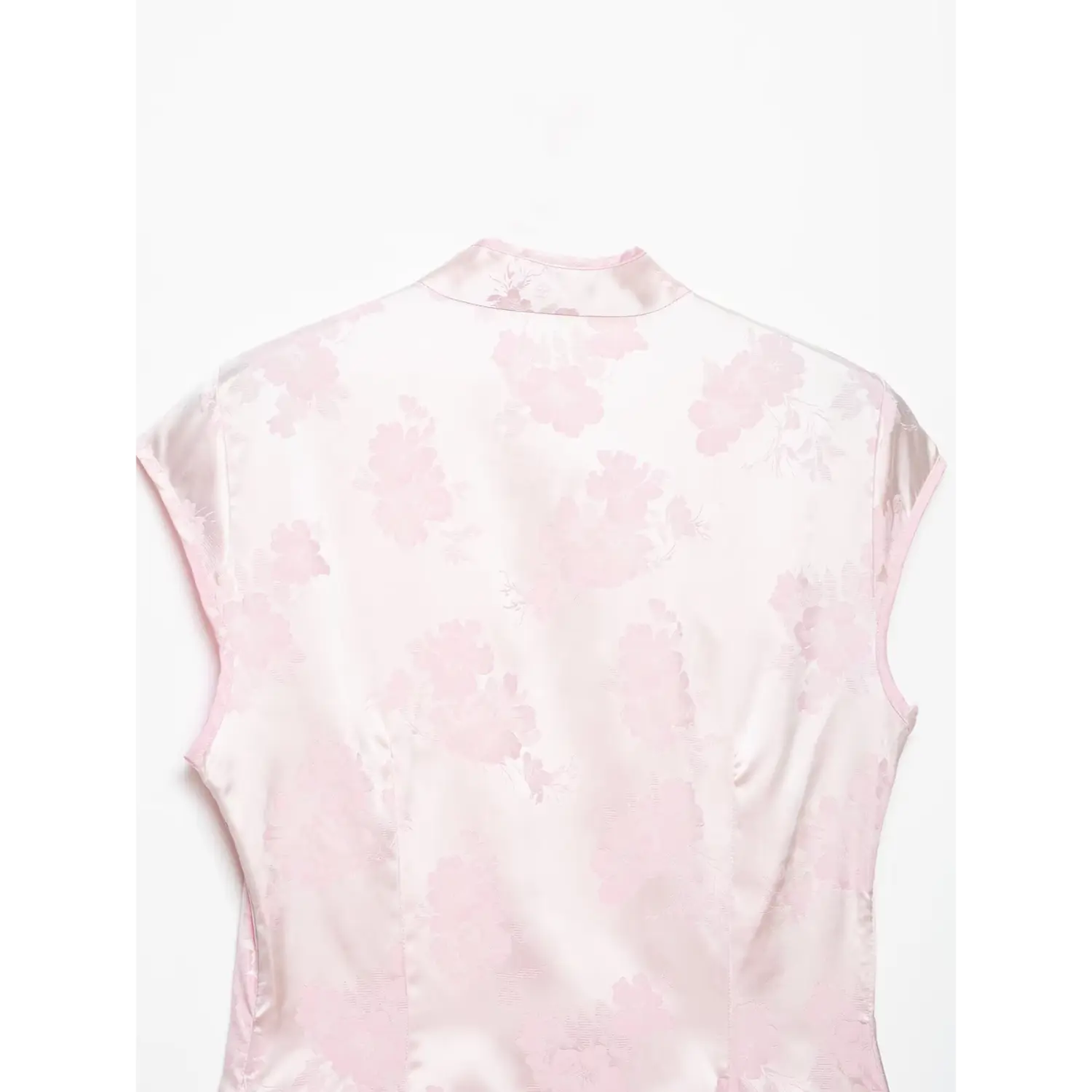 Back shoulder close-up, subtle floral jacquard weave, smooth satin finish, princess seam stitching