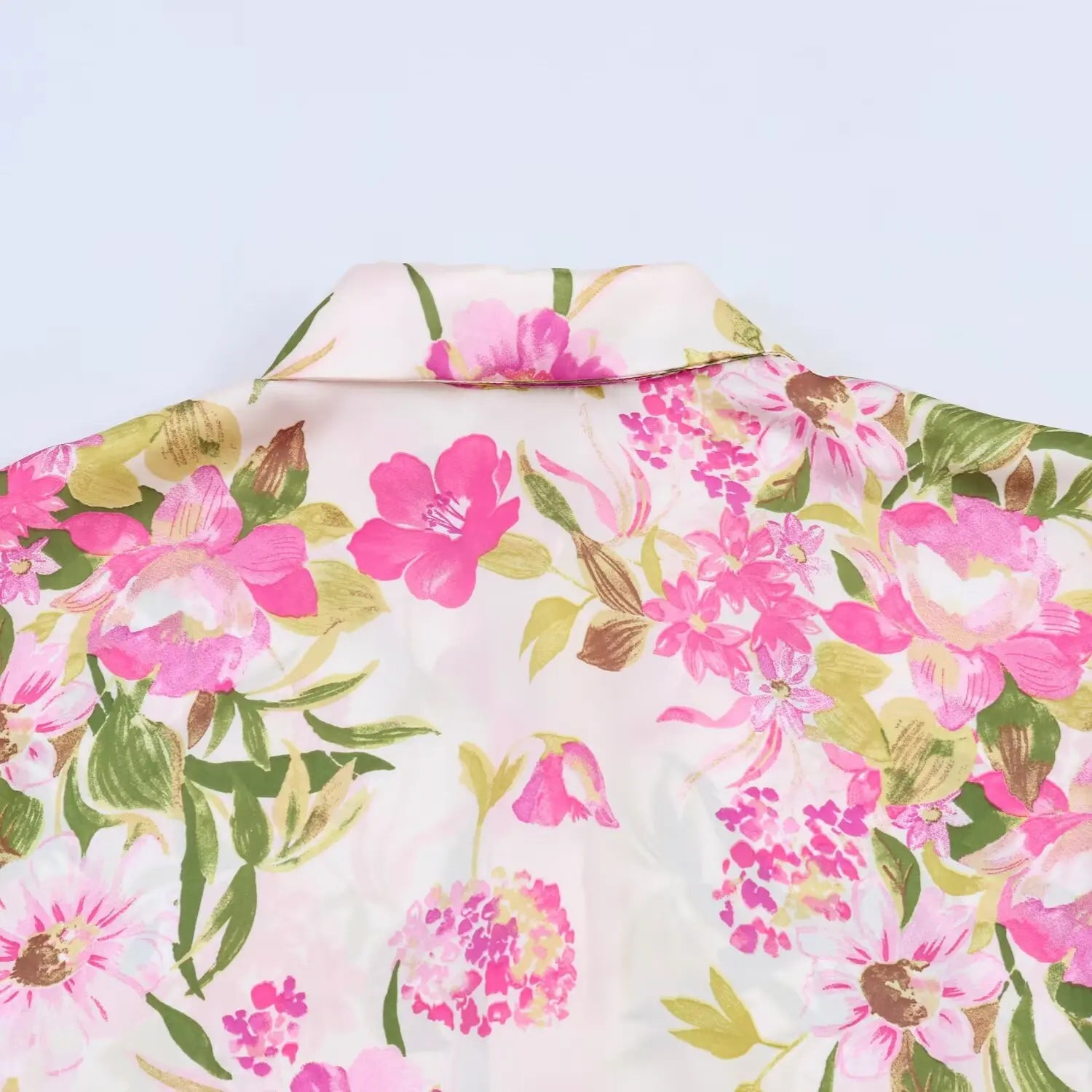 Back shoulder close-up, scattered peony floral pattern, glossy satin weave detail