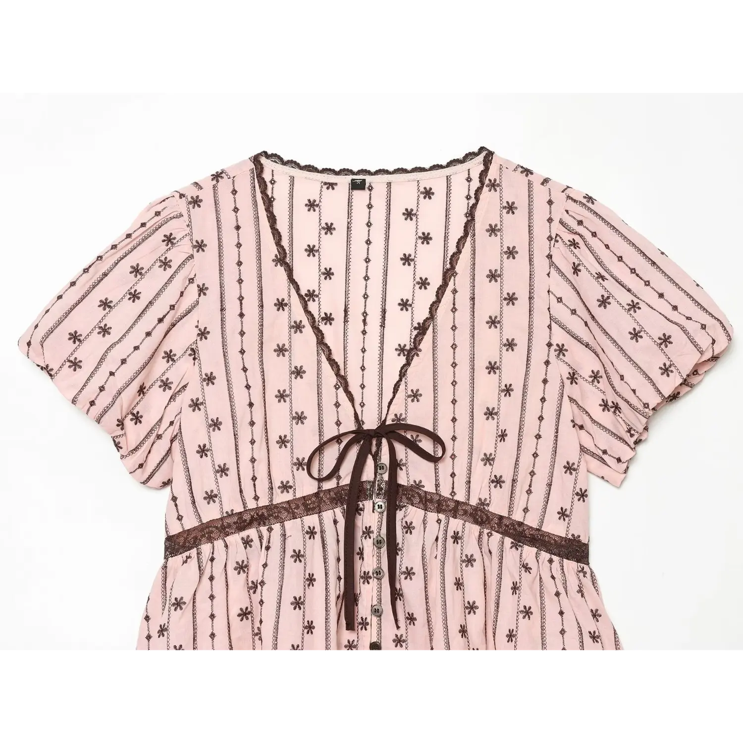 Close-up of full front V neckline, brown scalloped lace edging, center ribbon bow, vertical small flower stripe pattern