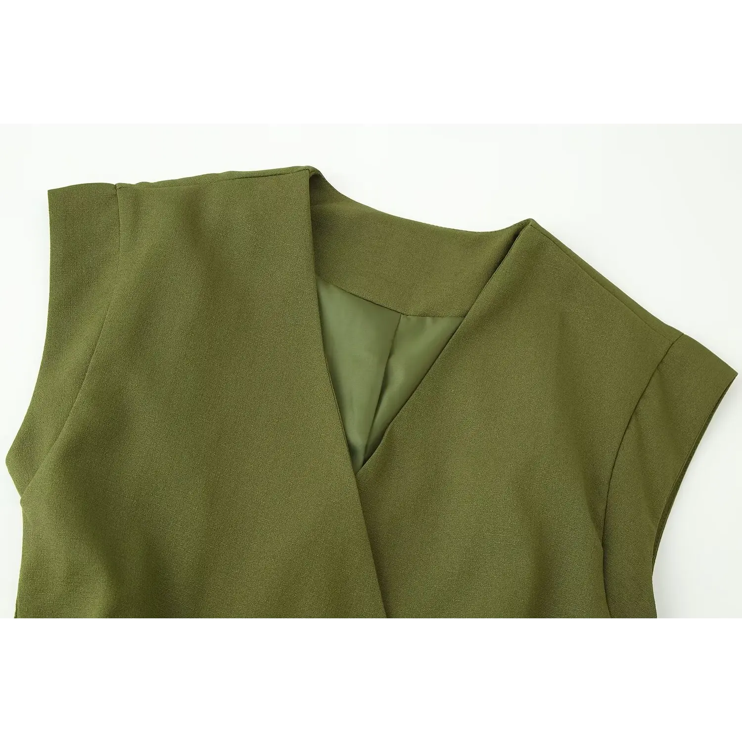 Neck & shoulder close-up, deep V folded lapel design, smooth olive lining, fine woven suit fabric texture