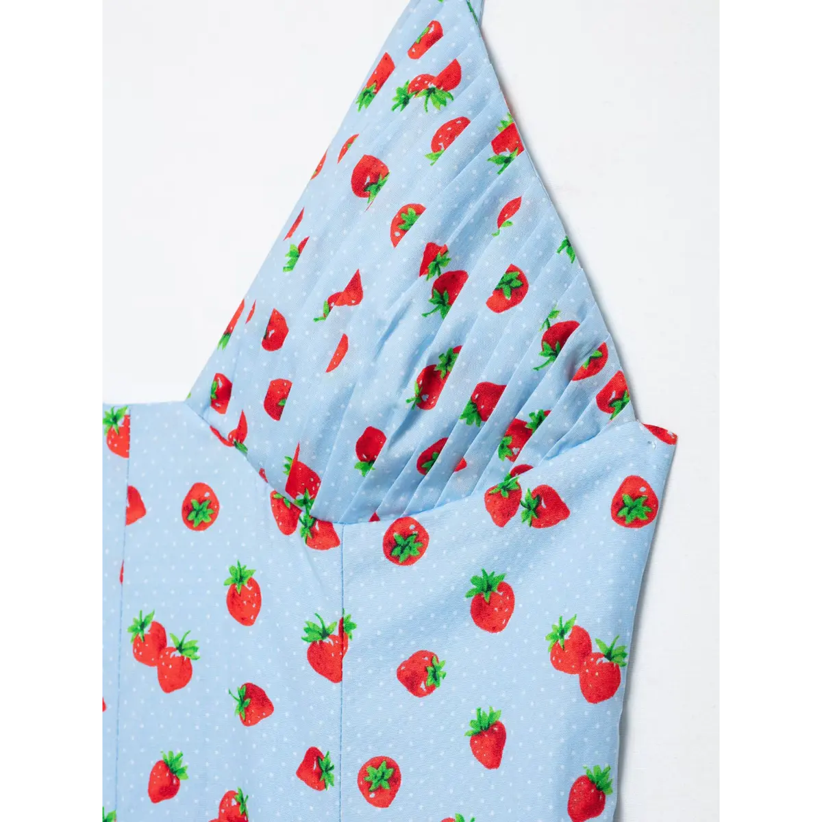 Macro detail accordion pleat & strawberry dot printed fabric
