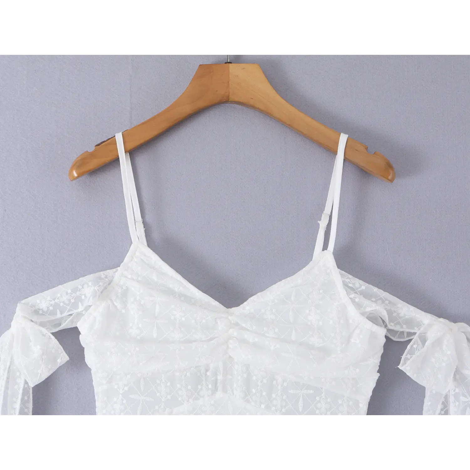 V-neck shirred eyelet floral embroidered bust macro close-up, center gathering double sheer embroidery soft figure flattering neck craft shot