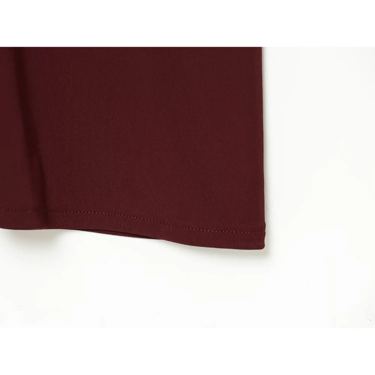 Close-up of burgundy hem stitch detail