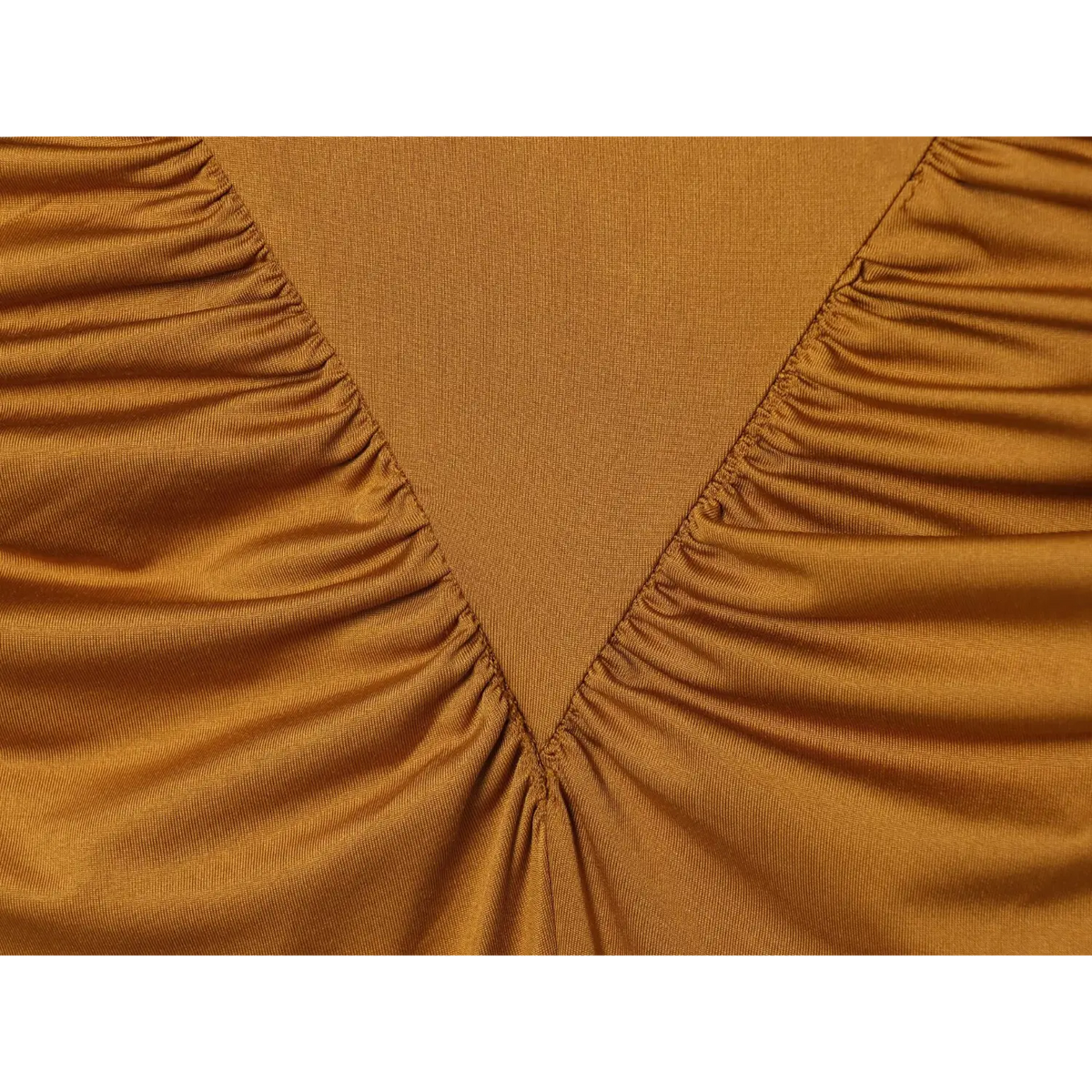 Close-up of mustard ruched seam detail