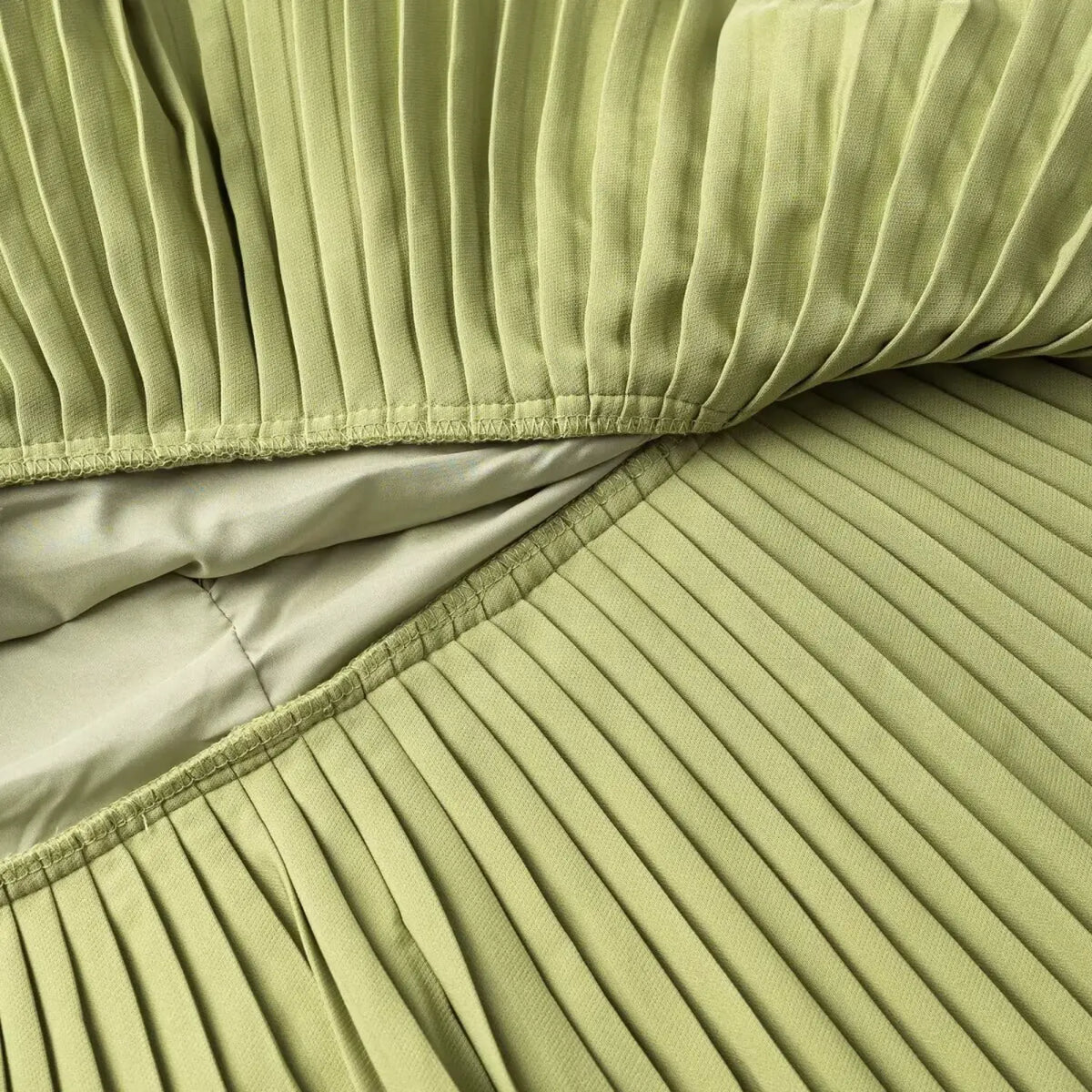 Close-up of green pleated skirt lining