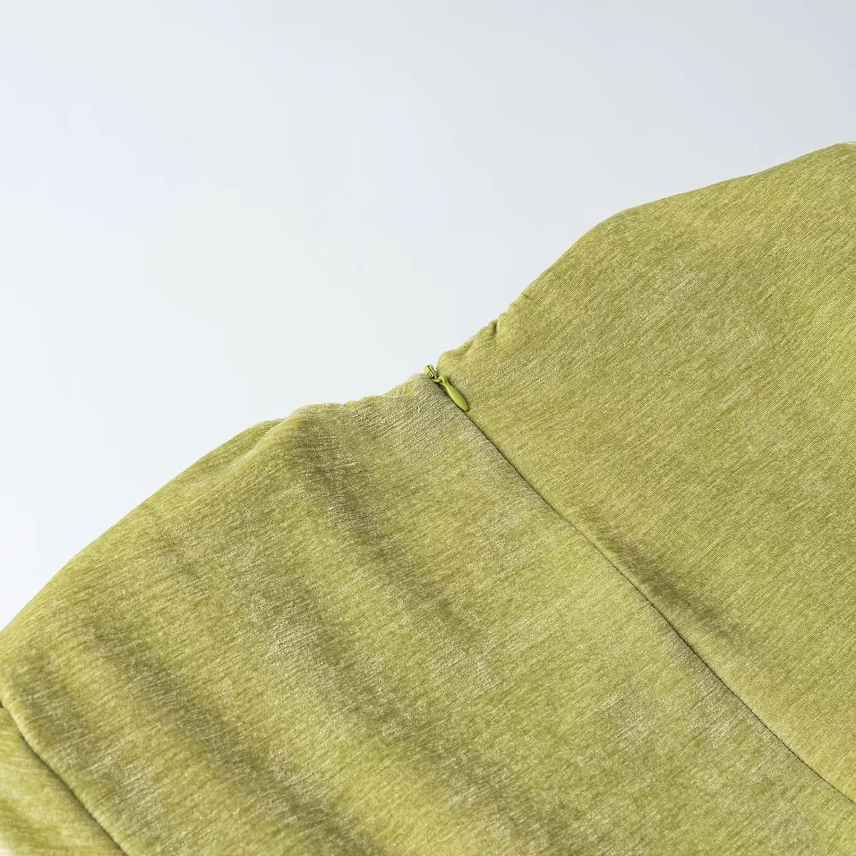 Close-up of green back neck zipper