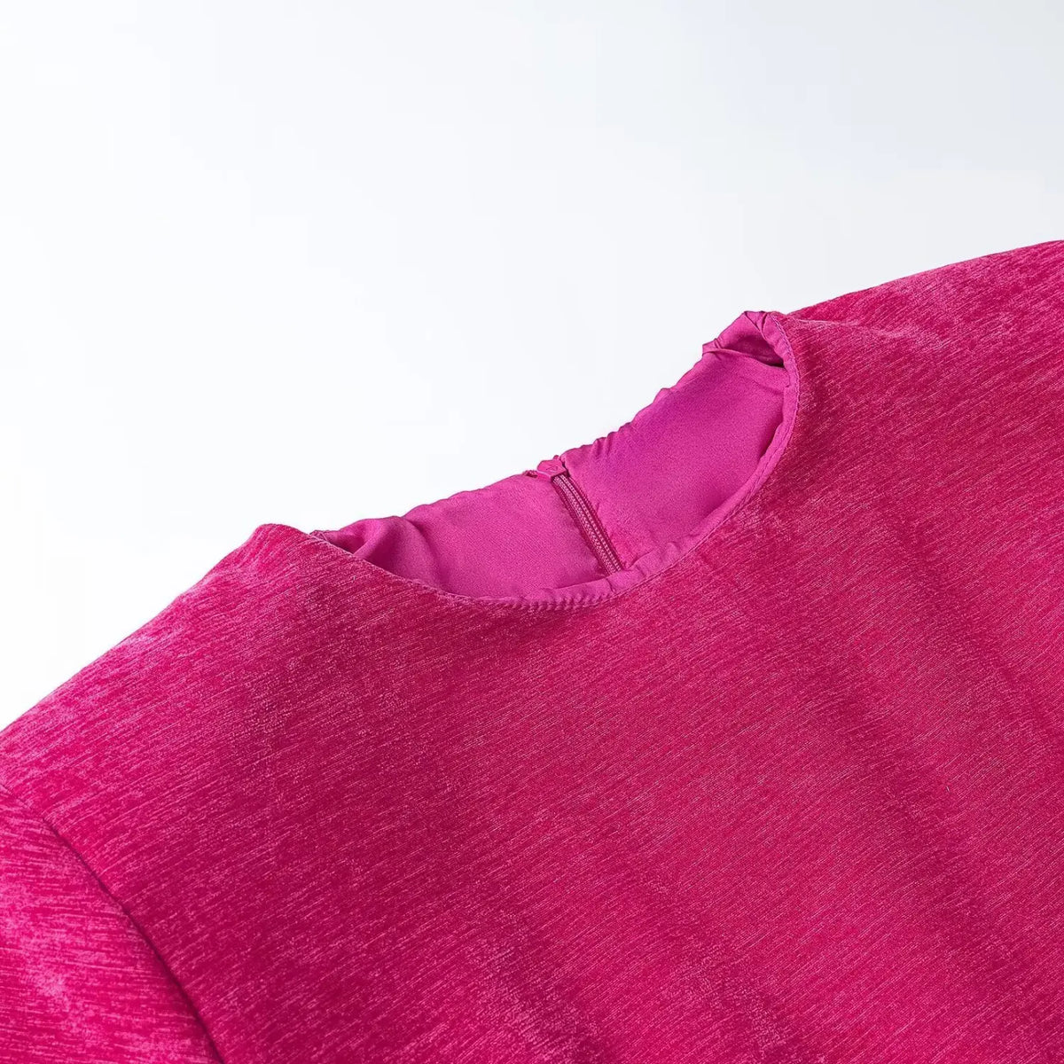 Close-up of fuchsia collar and back zipper