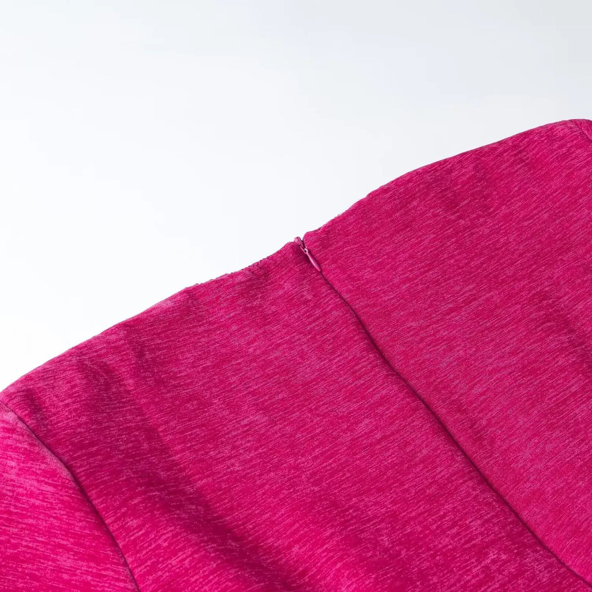 Close-up of fuchsia back neck zipper