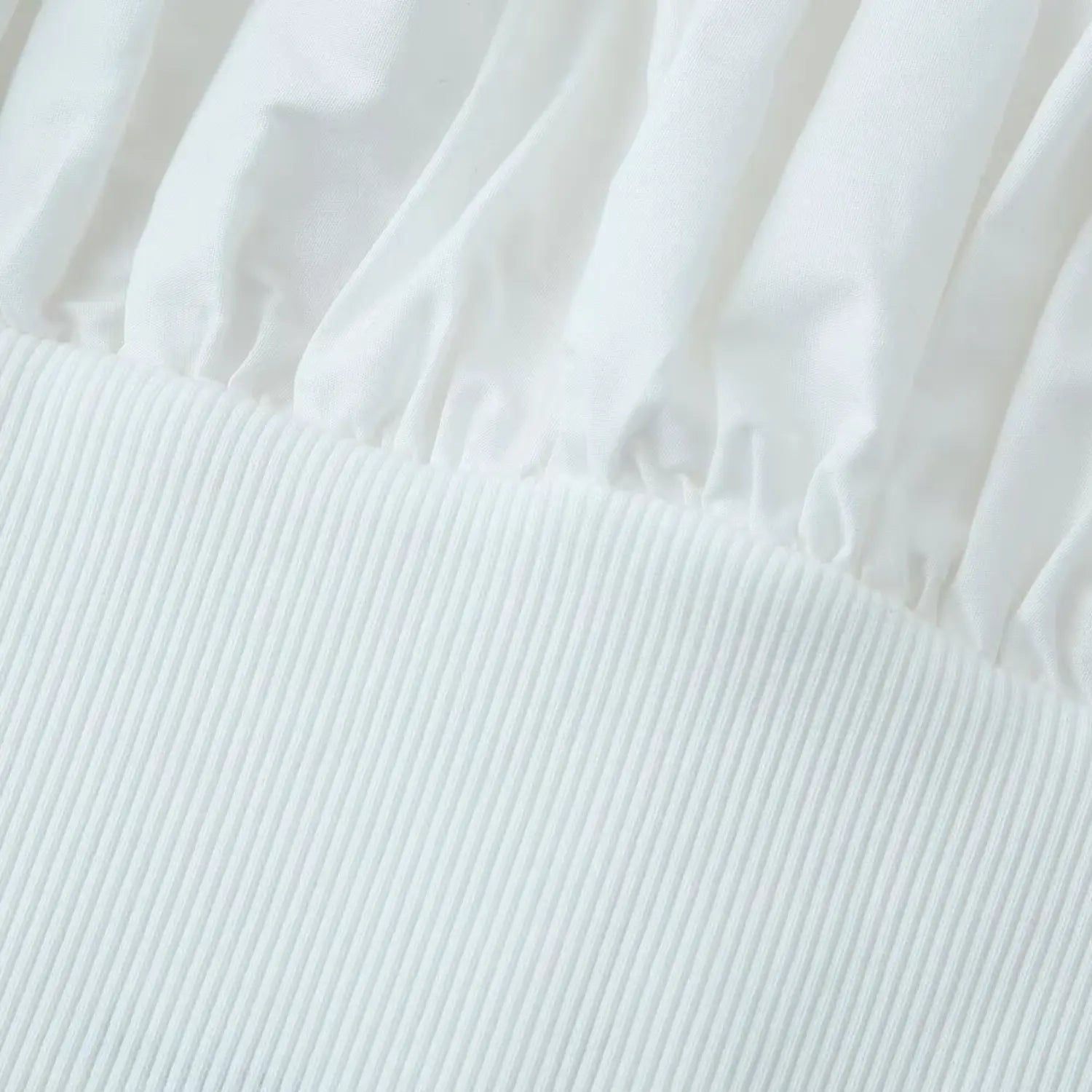 Macro texture shot of stretch vertical rib knit fabric on lower torso