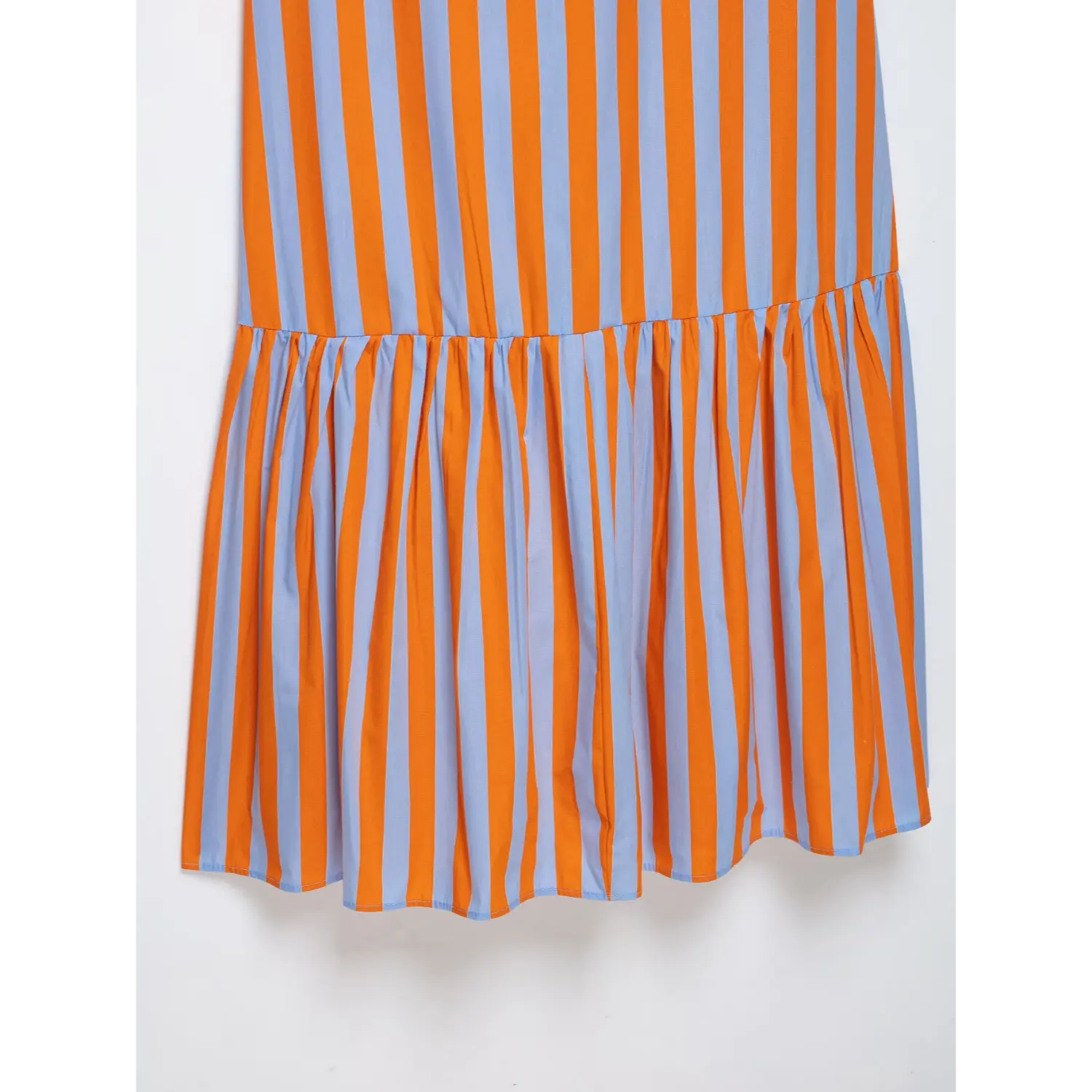 Partial view gathered ruffle skirt panel on orange blue striped cami maxi dress