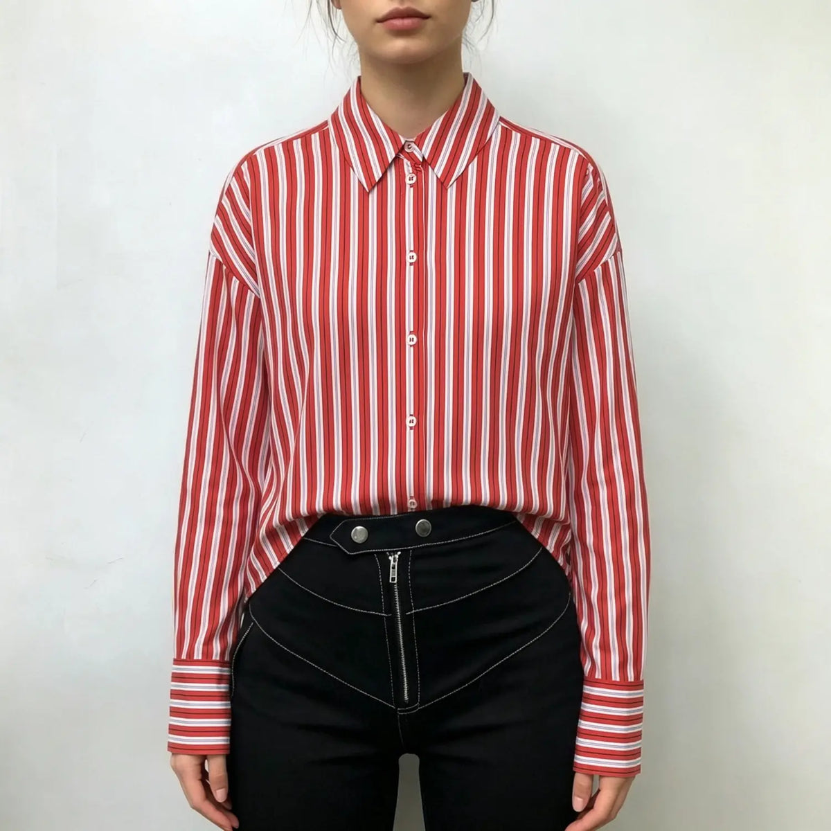 Model wearing navy vertical stripe drop shoulder button down shirt