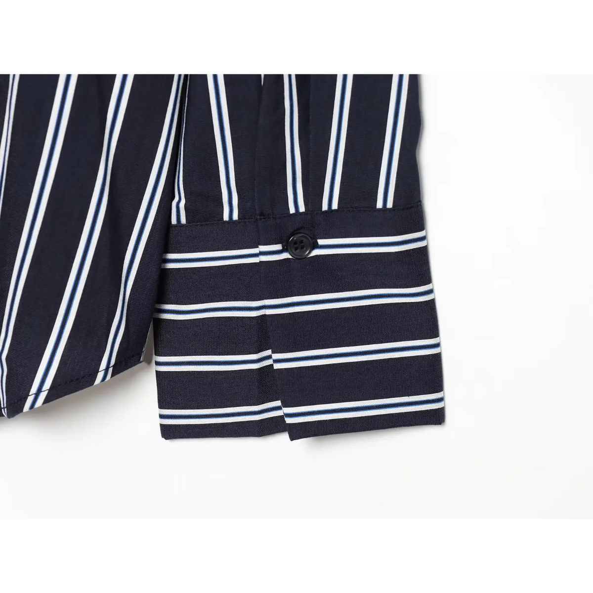 Close-up of cuff button on navy stripe shirt
