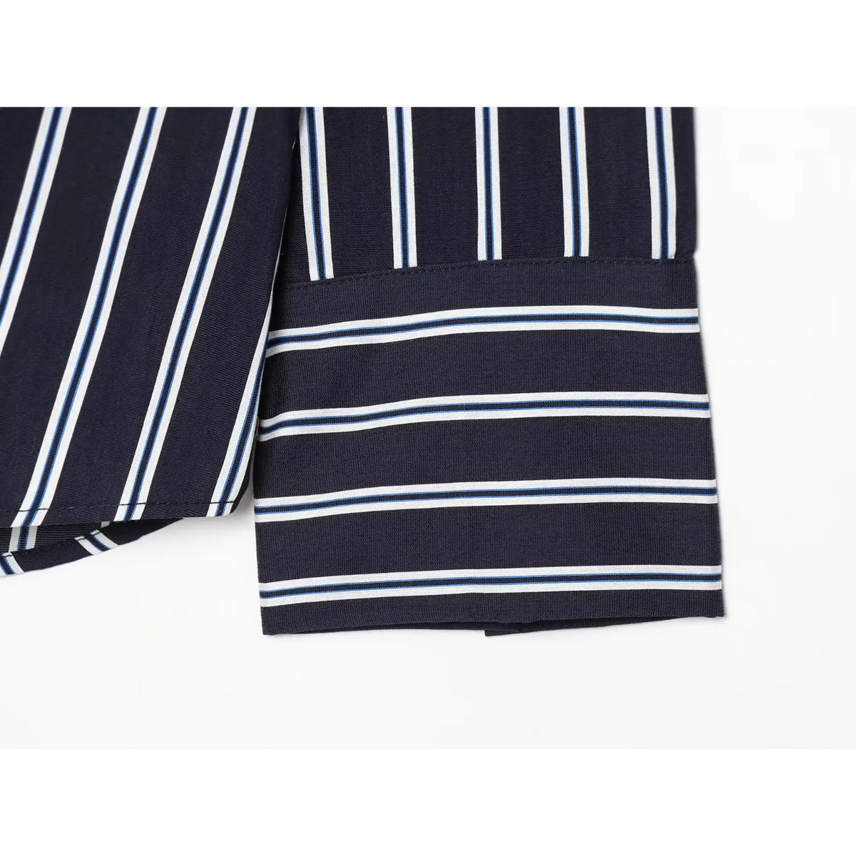 Close-up of horizontally striped wide cuff on navy stripe shirt