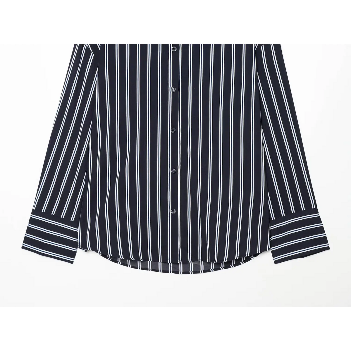 Close-up of curved hem and wide striped cuffs on navy stripe shirt