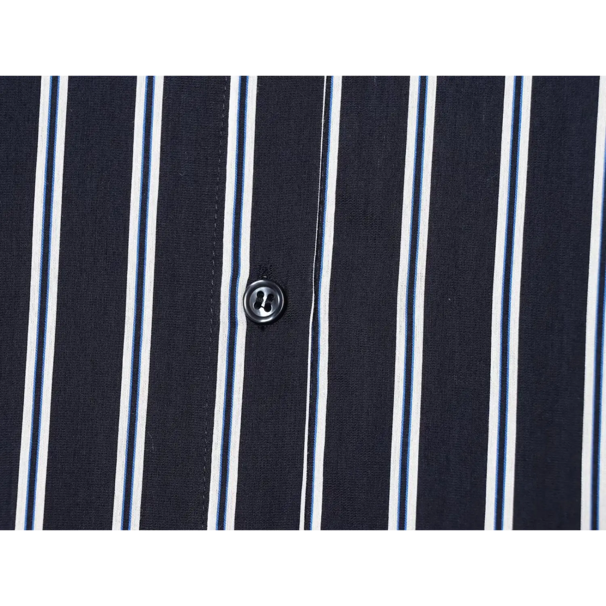 Close-up of front placket button on navy stripe shirt