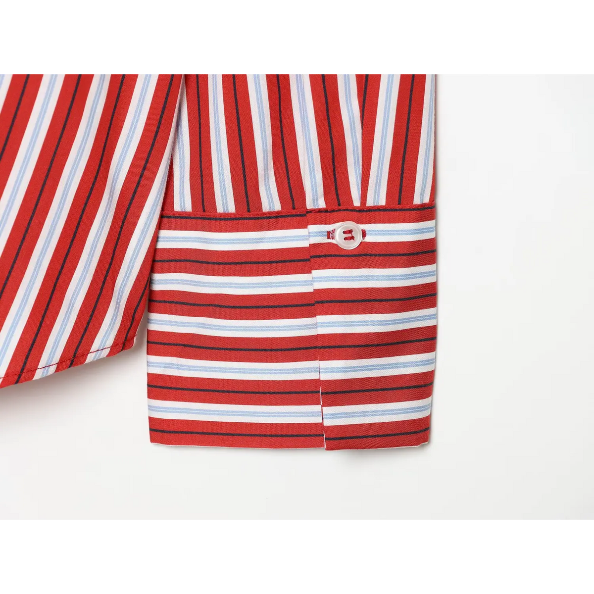 Close-up of cuff button on red stripe shirt