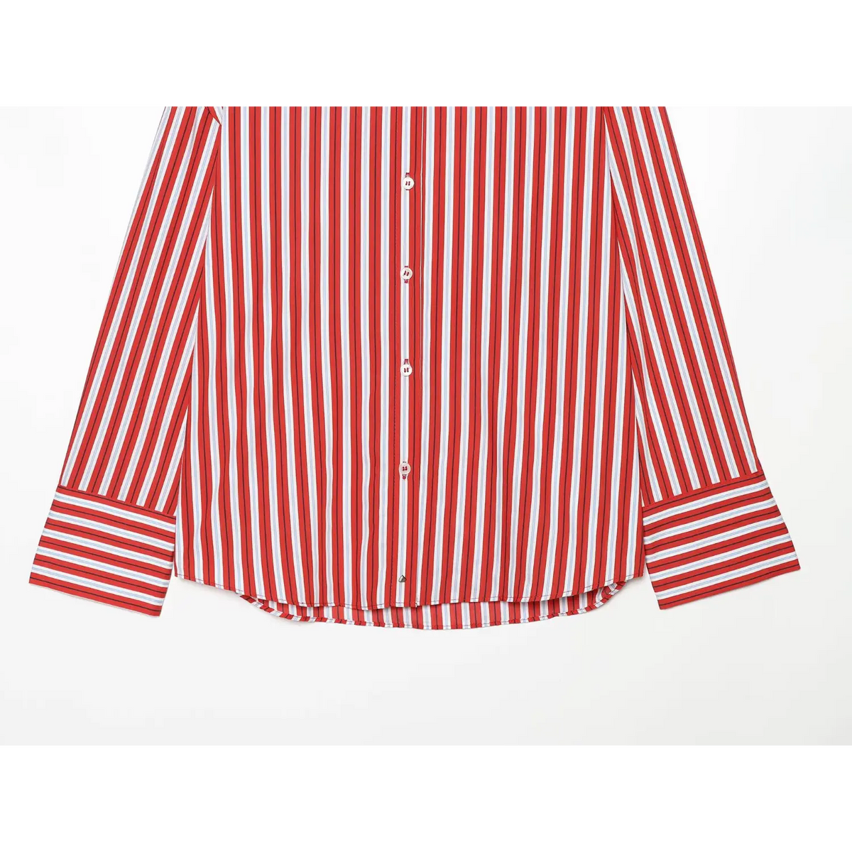 Close-up of curved hem and wide striped cuffs on red stripe shirt