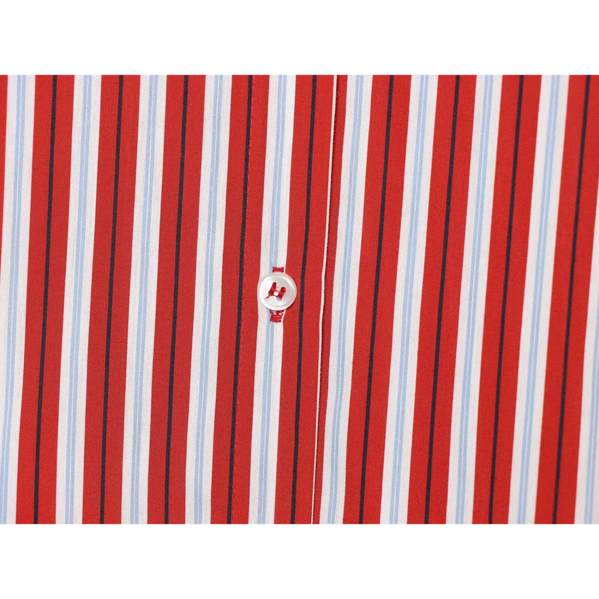 Close-up of front placket button on red stripe shirt