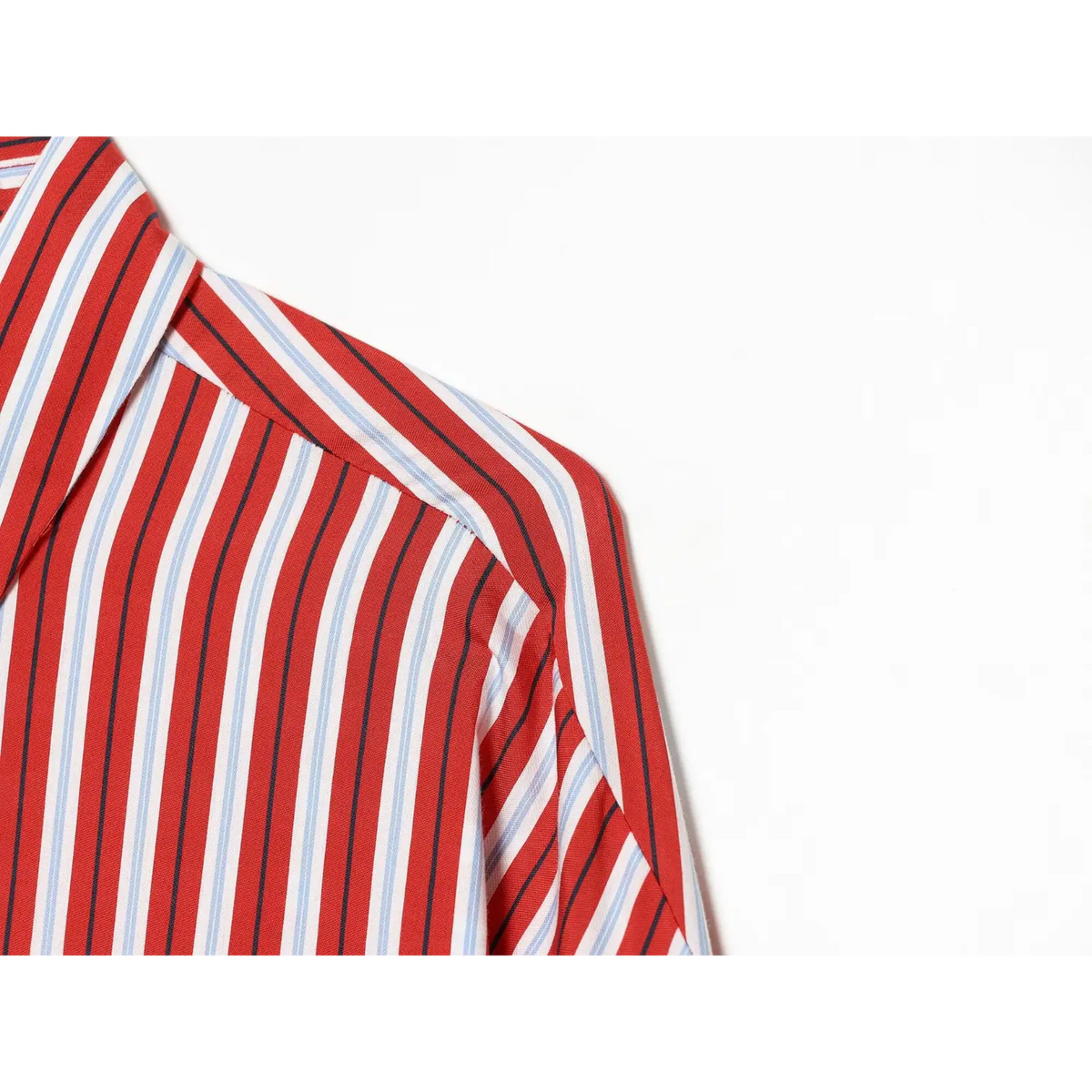 Close-up of drop shoulder seam on red stripe shirt