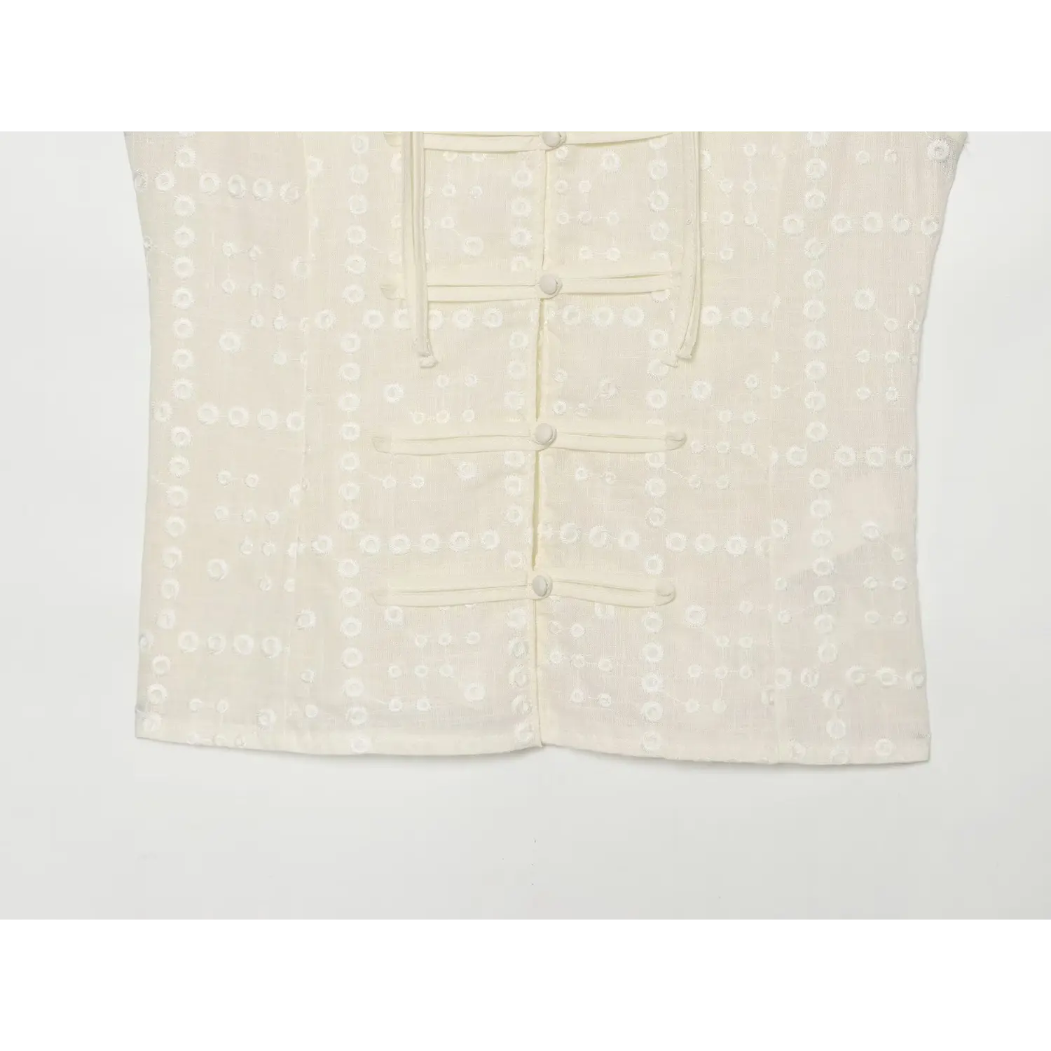 Vest inner collar label macro close-up, woven size tag V placket binding cutout embroidery neat Chinese style neck sewing detail shot