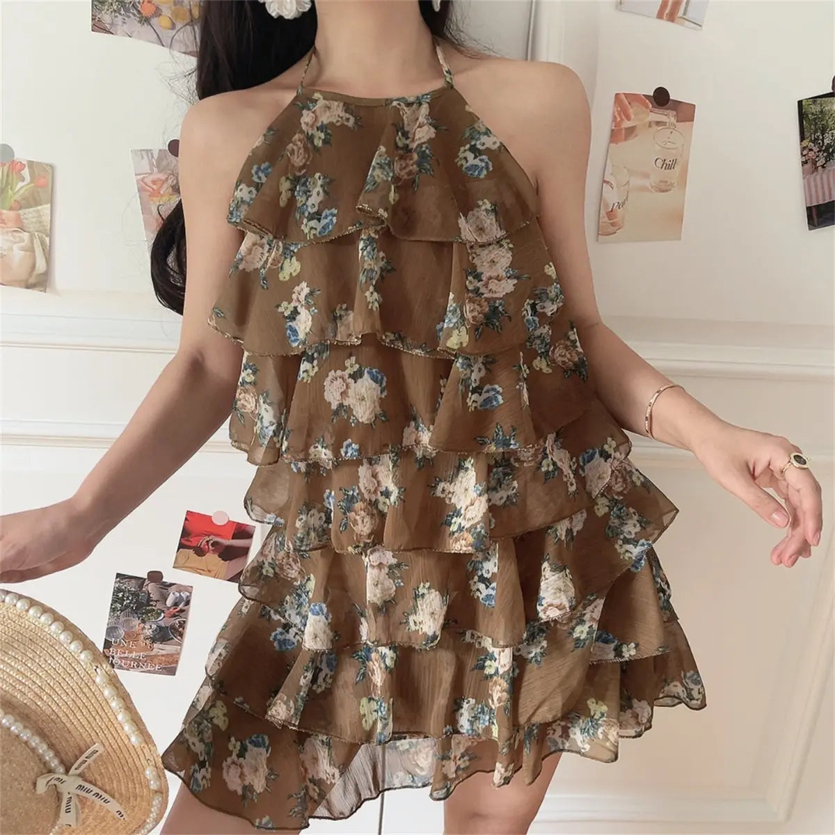 Side lifestyle photo of multi-tier ruffle halter floral mini dress, lightweight sheer chiffon for summer dating style.