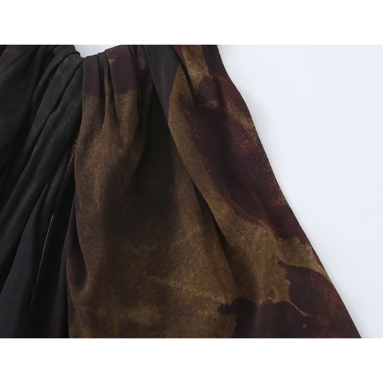 Close‑up shot of halter neck gathering and vintage sepia floral print fabric
