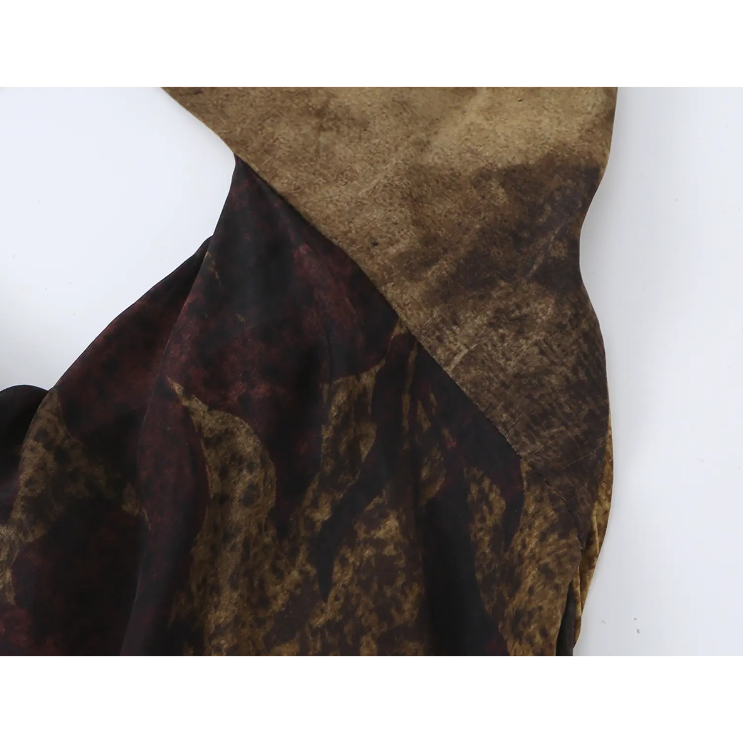 Close‑up of side waist cutout and fabric stitching on vintage floral halter maxi dress