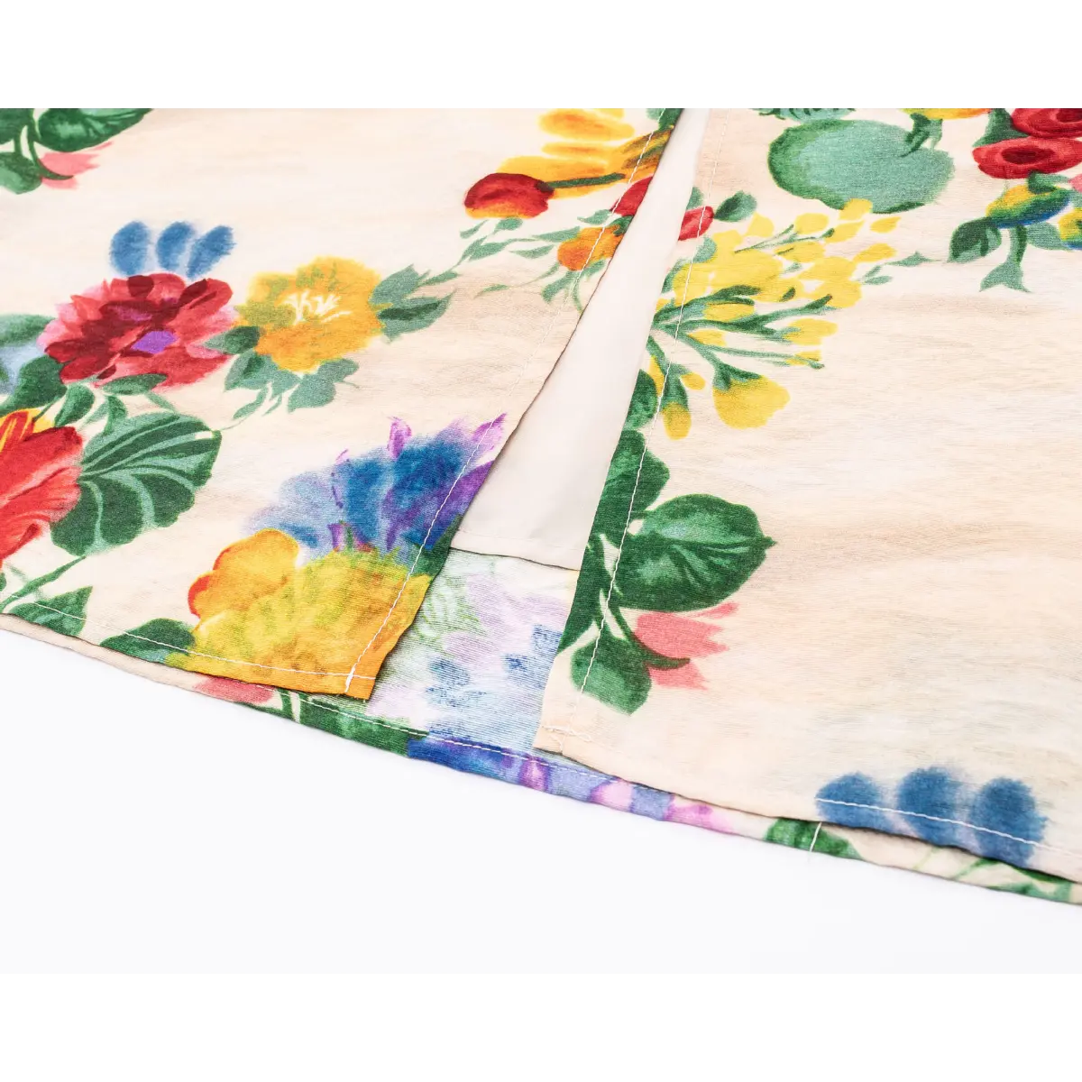 Close-up of front skirt split, double-layer fabric with clean finished edge stitching.