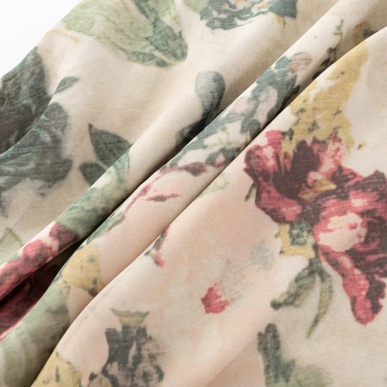 Macro close‑up of lightweight mesh fabric with vintage rose floral print showing fabric drape and texture