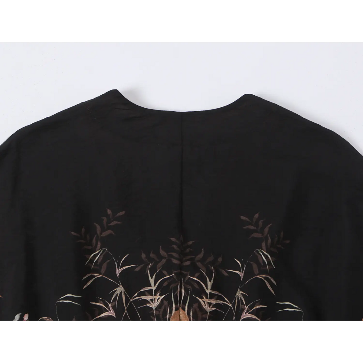 Close-up of back neckline and plain black yoke