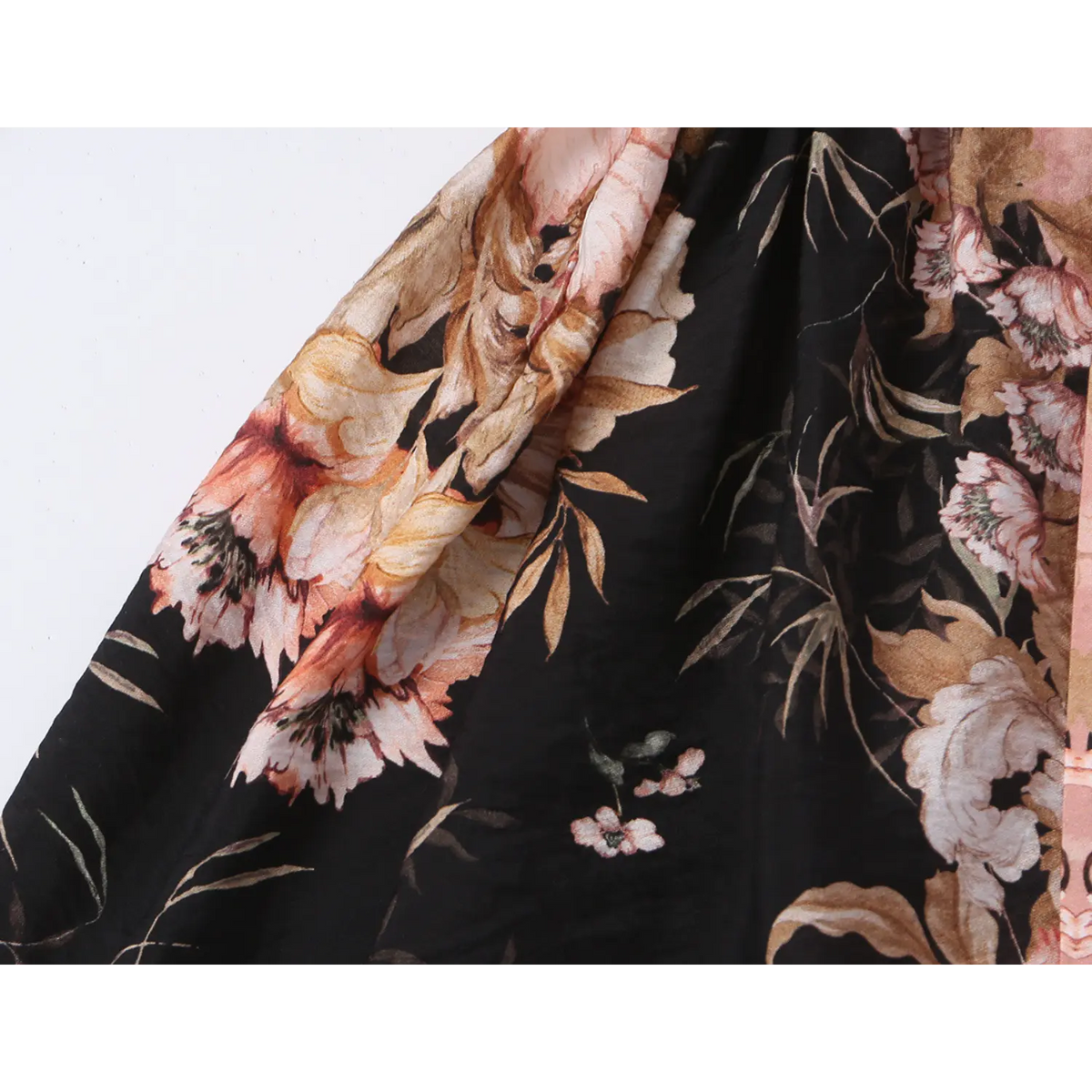 Close-up of skirt fabric and floral print texture