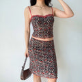 Front lifestyle shot on model of vintage printed mesh coordinate set, lace neck cami top, mid-length pencil skirt, everyday casual wear