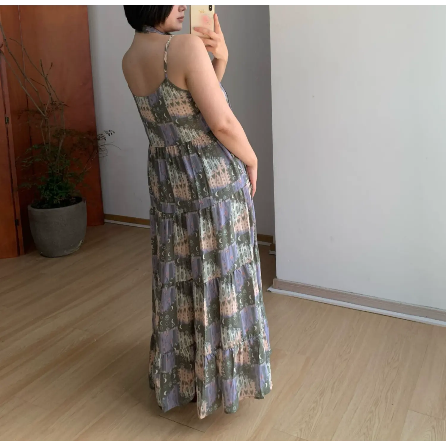 Vintage moon forest print cami long dress back side full view, u-shaped back neck loose tiered maxi skirt, home wood floor indoor outfit photo
