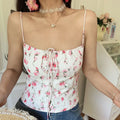 Vintage pink watercolor floral cami crop top, long adjustable front tie elastic neckline, low angle full indoor model wearing shot