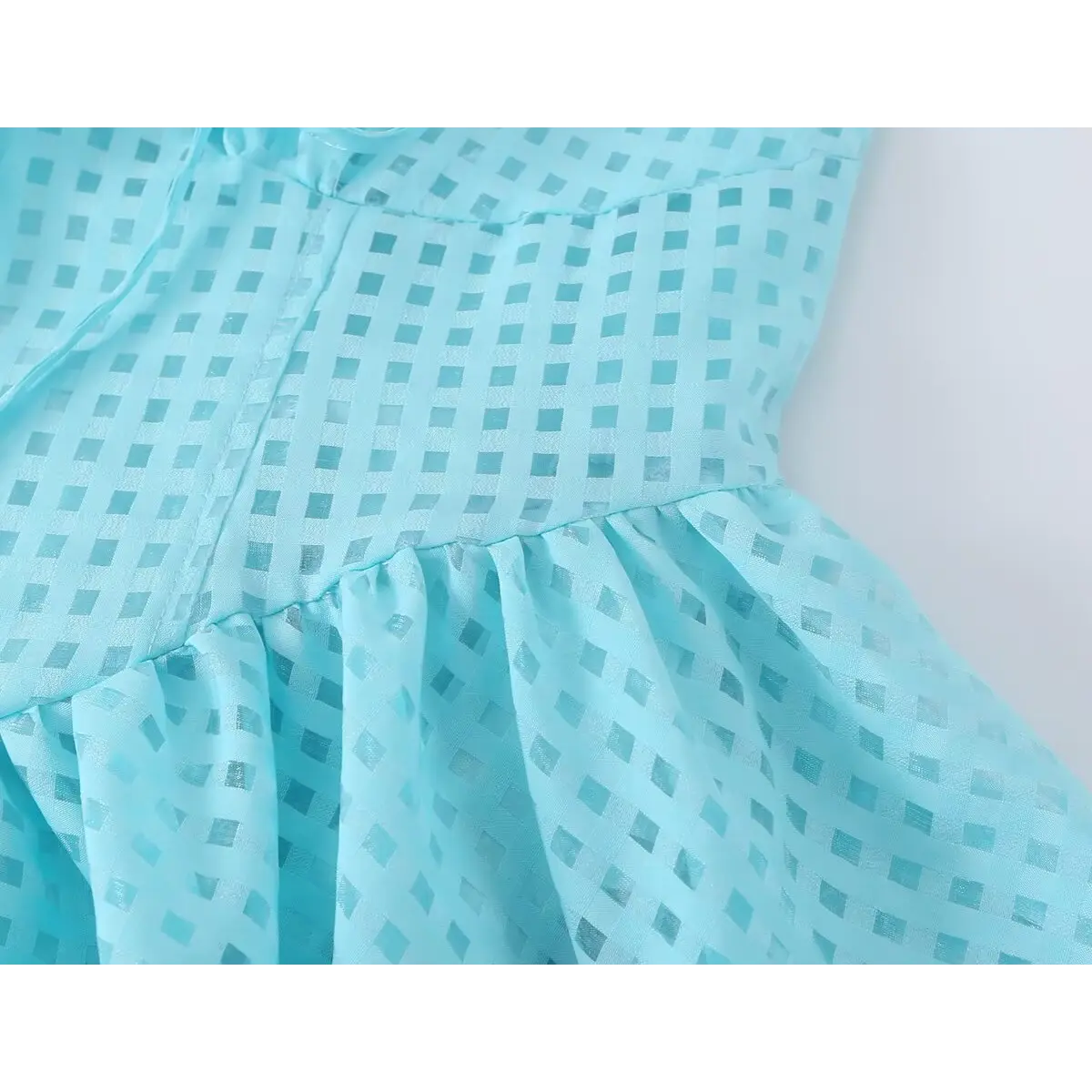 Waist seam gathering detail between bodice and flare jacquard skirt