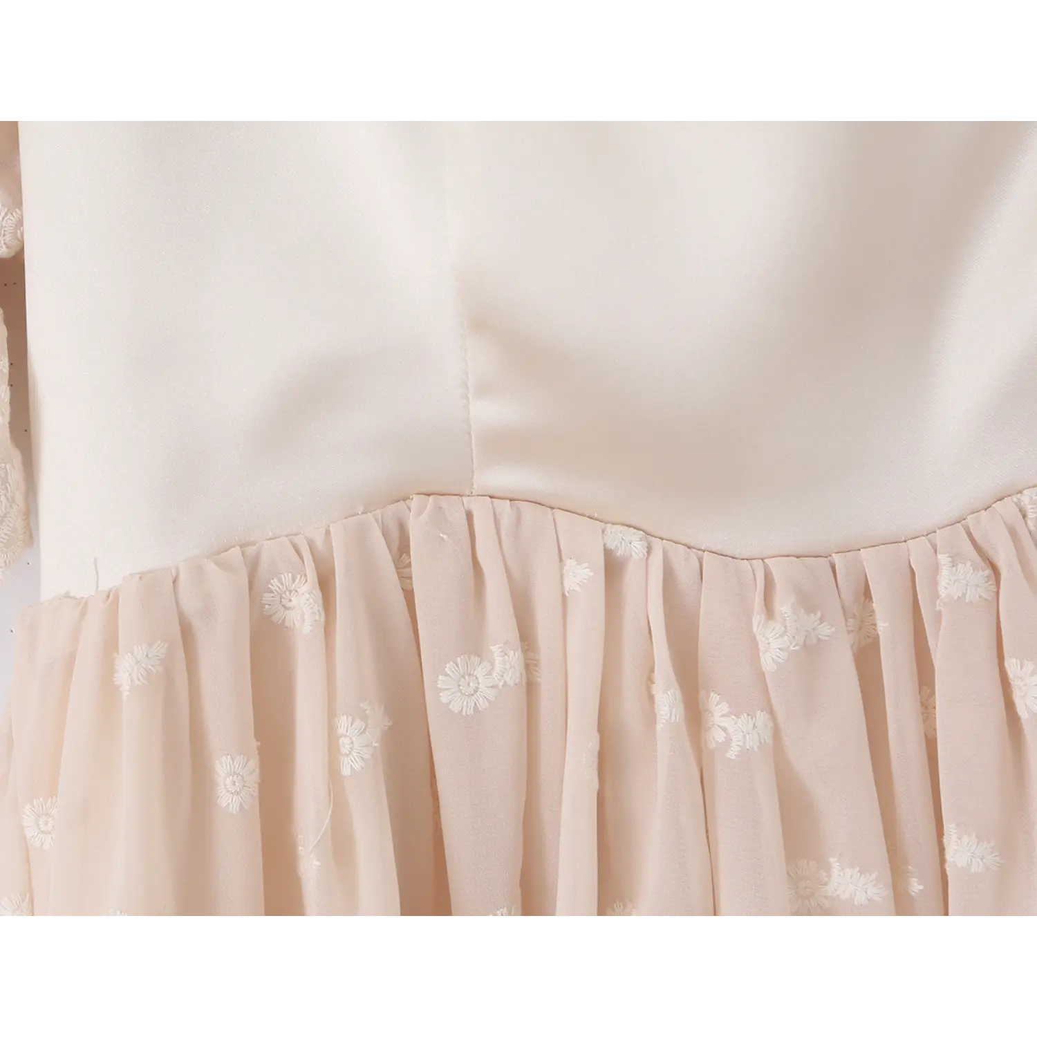 Waist gathered tulle skirt splice macro close-up, even dense shirring for fluffy A-line skirt satin waistband tulle cutting detail shot