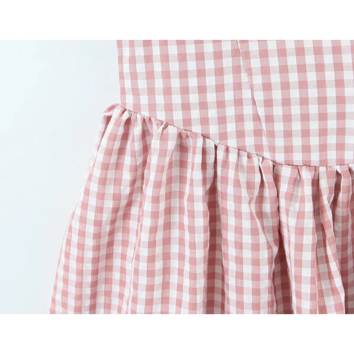 Waist connection gathered seam close of gingham sundress