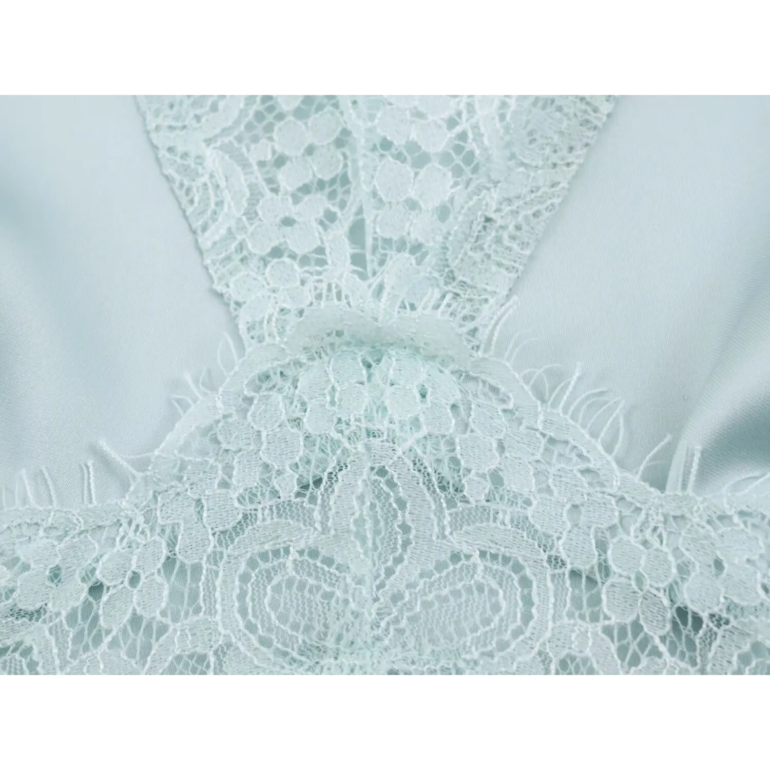 Floral eyelash lace waist panel detail on light blue satin dress