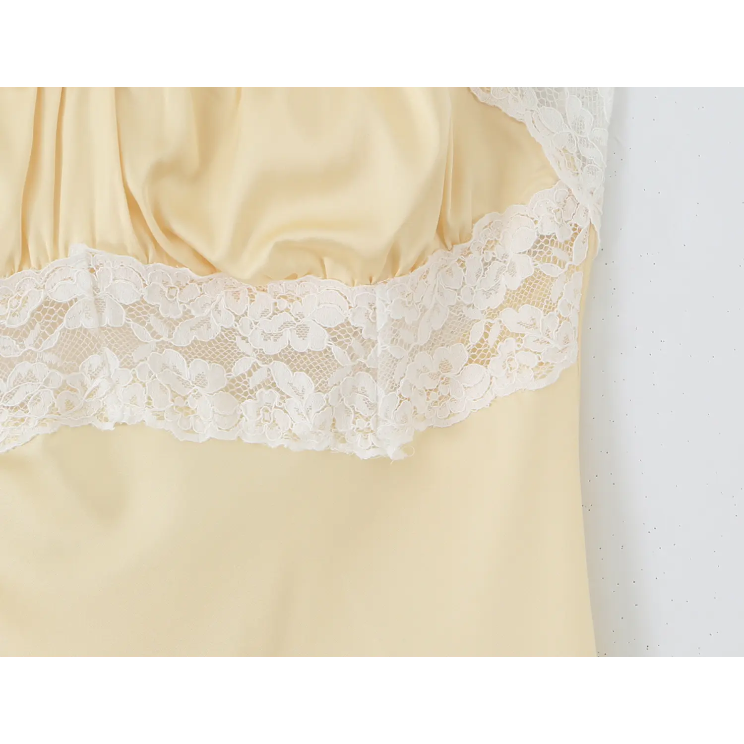 Waist lace satin gather seam macro close-up, neat serging stitching lace waist panel figure shaping stitching detail shot