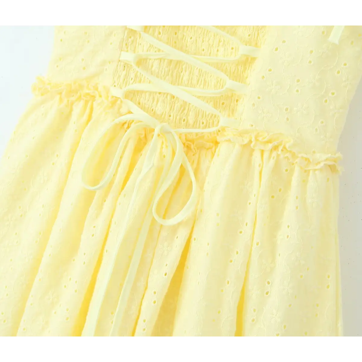 Waist seam close, frill trim + hanging long ribbon bow after back corset lace-up design.