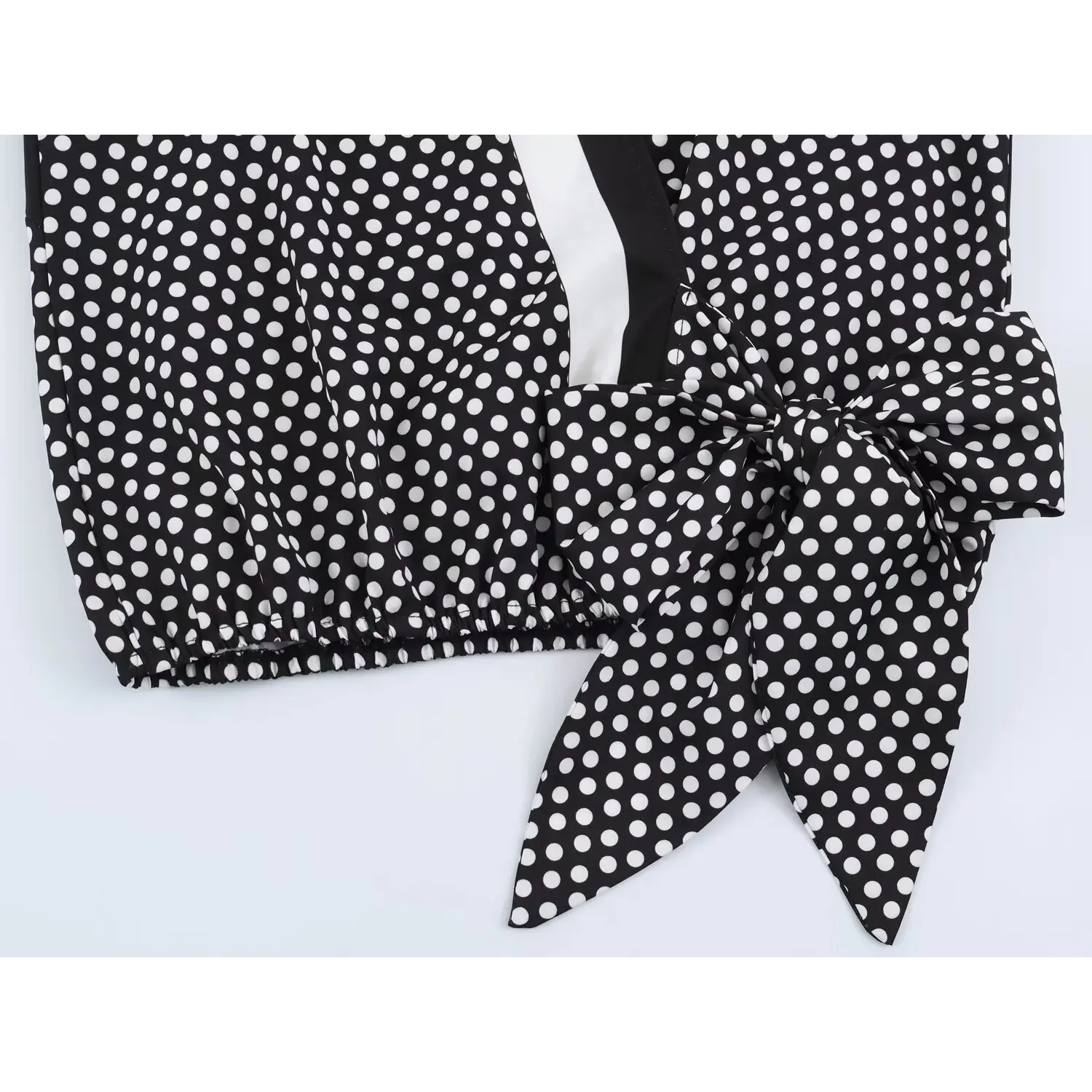 Side waist self-fabric tie bow flat overview, matching polka dot fabric, gathered elastic waist hem